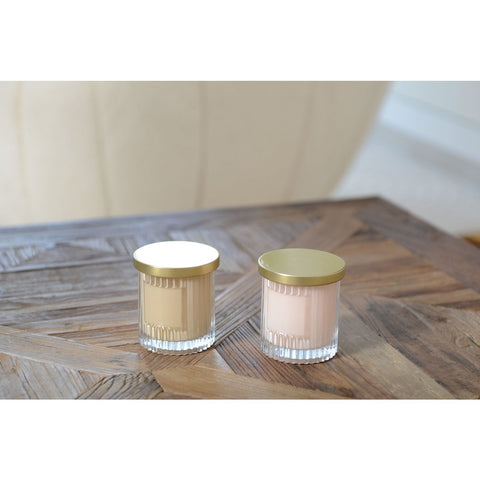 Candela rosa con profumo di cocco a copertura dorata