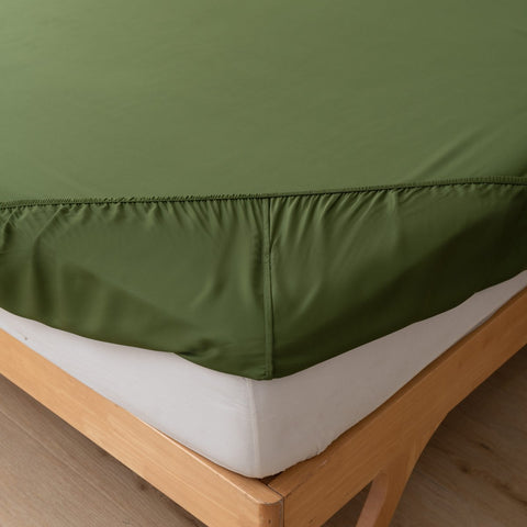 Deep Moss green bamboo topper sheet on a modern bed
