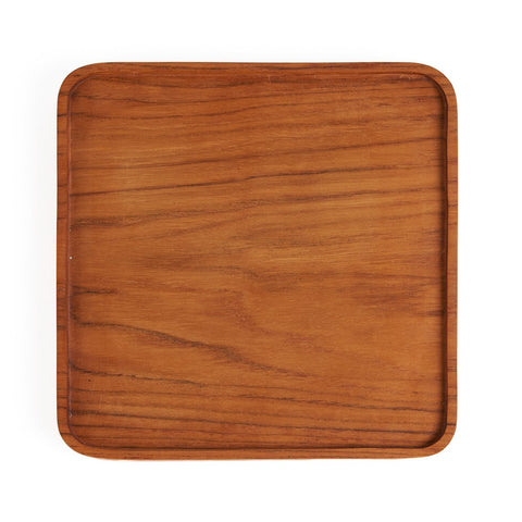 Square saucer made of natural teak wood with rounded corners, 15 cm in diameter, in the Japandi style.