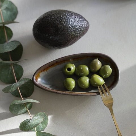 Rectangular Côa M stoneware plate used to serve an assortment of olives